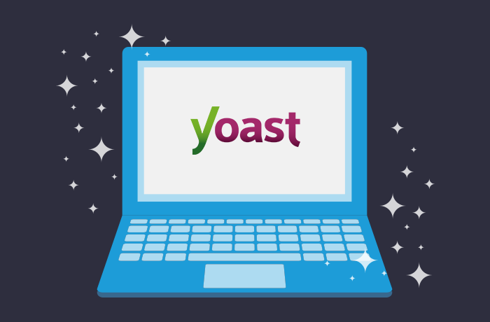 蓝笔记本电脑前面深蓝背景图 屏幕上YoastSEO标识